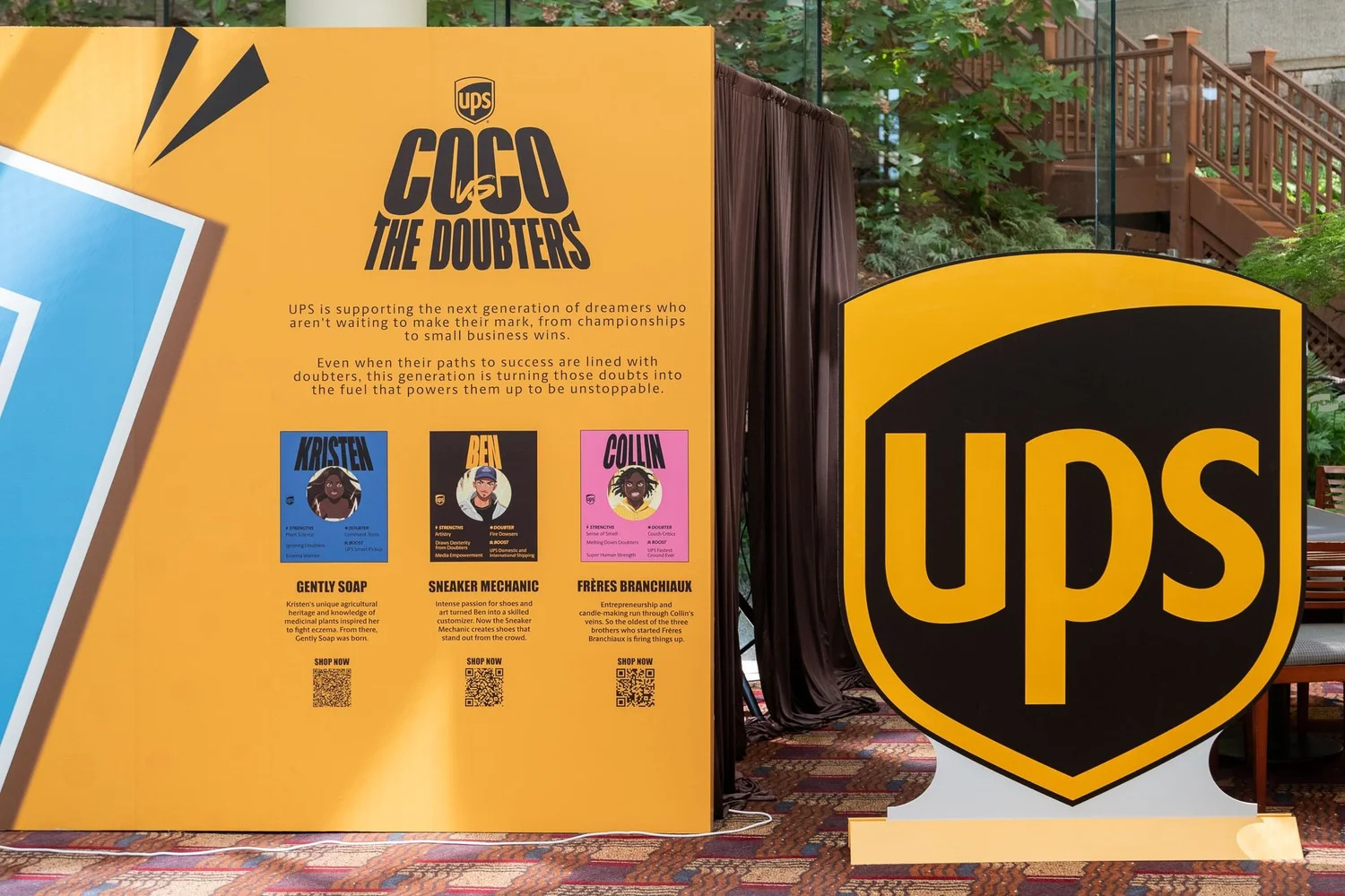The yellow UPS Coco vs The Doubters campaign installation featuring illustrated small-business founders