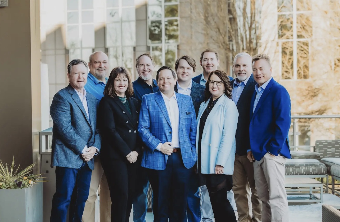 Members of the FreightWise team gathered outdoors for a group photograph