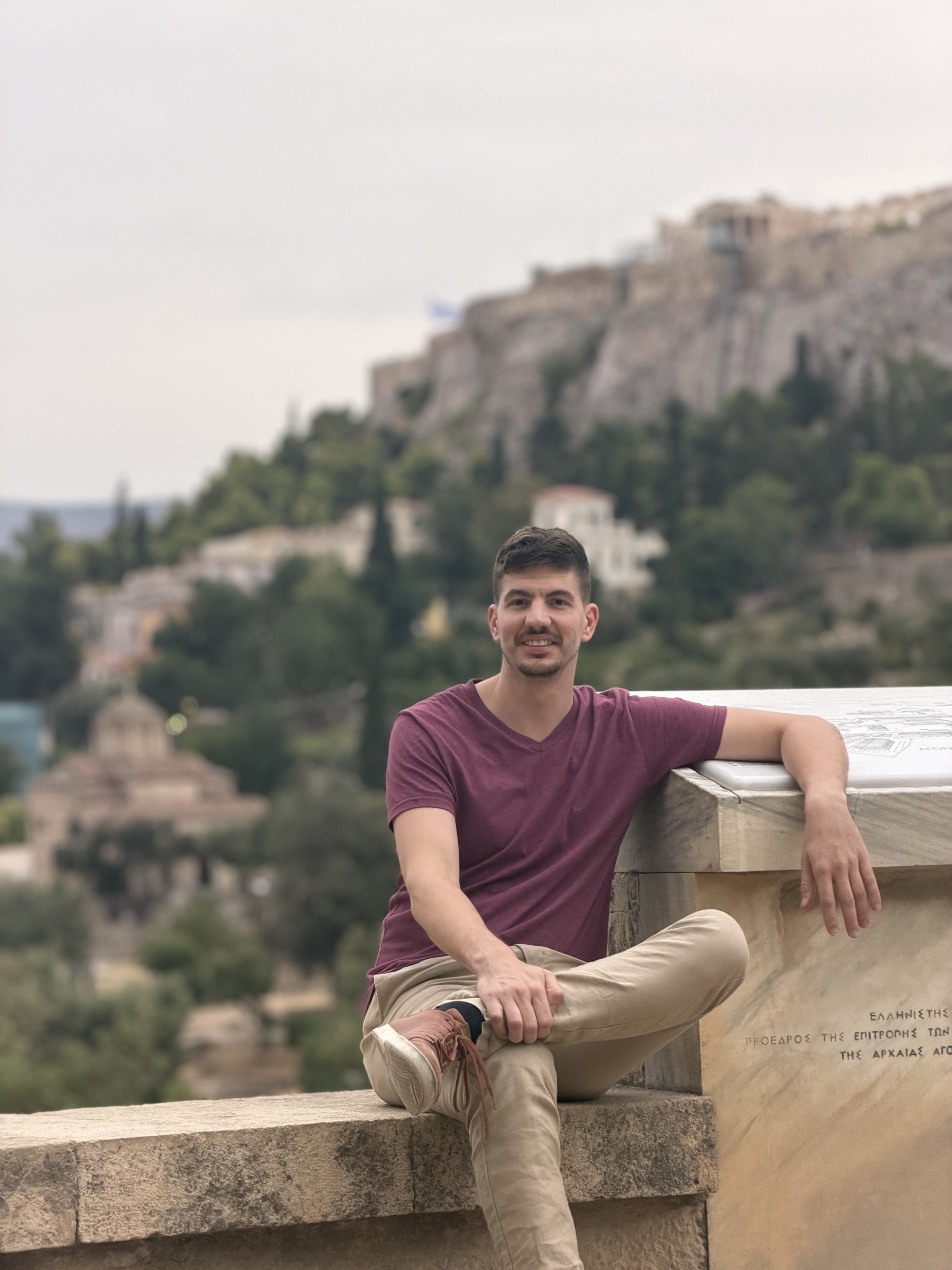 Chris Heinrich in the Ancient Agora, with the Acropolis behind him