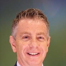 Chris Klopper smiling in an archival photograph