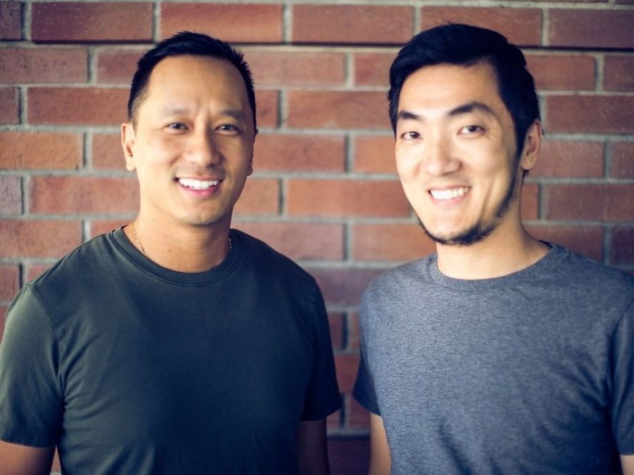 Chris Nguyen, left, and his co-founder Lee Liu standing in front of a brick wall