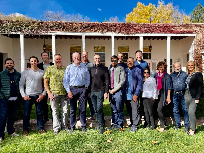 Executives posing outdoors at Los Poblanos during a Vistage gathering