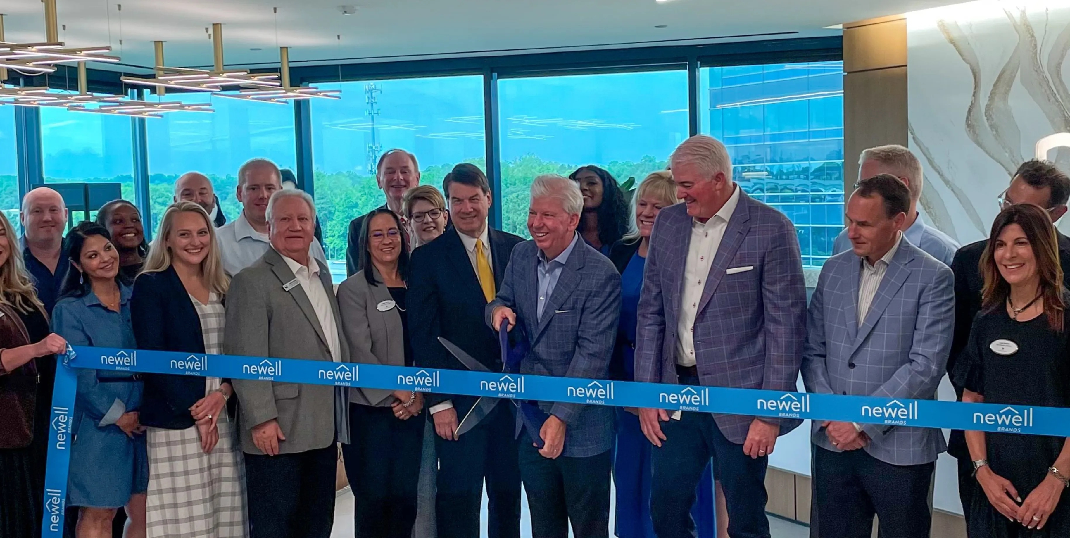 Chris Peterson joins colleagues and community representatives for Newell Brands’ headquarters ribbon-cutting in Sandy Springs.