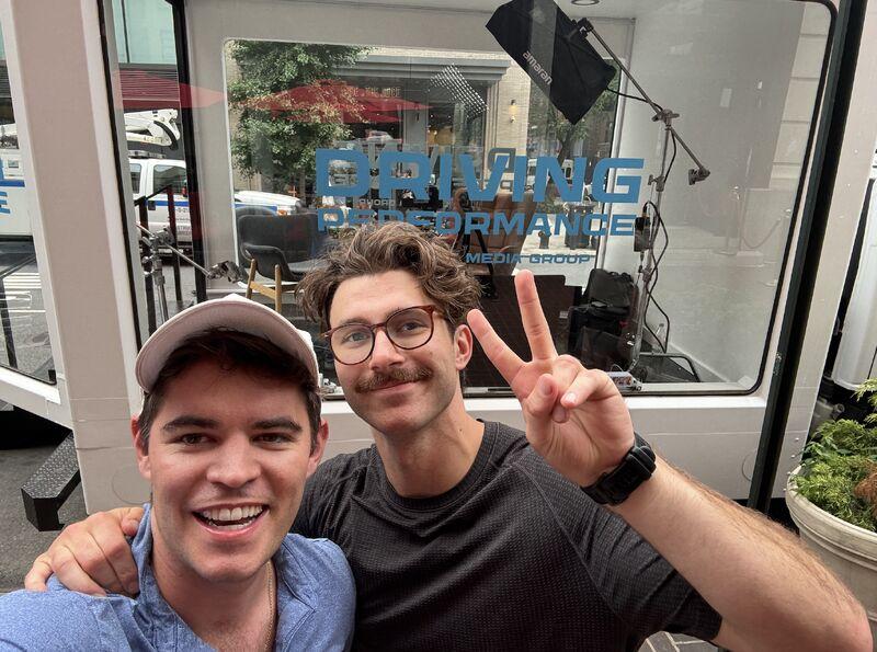 Tom Shea and Chris Tiffin taking a selfie outside the Driving Performance recording truck