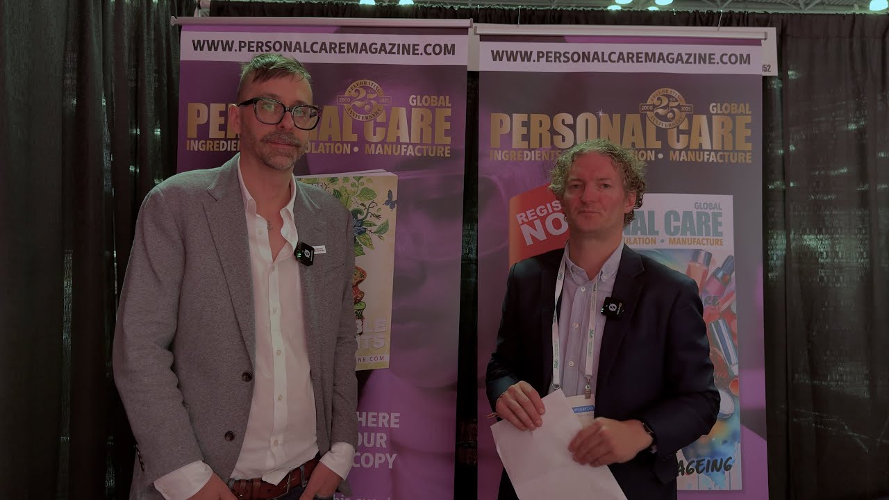 Chris Valencius, at left, speaking with an interviewer at a Personal Care Magazine event