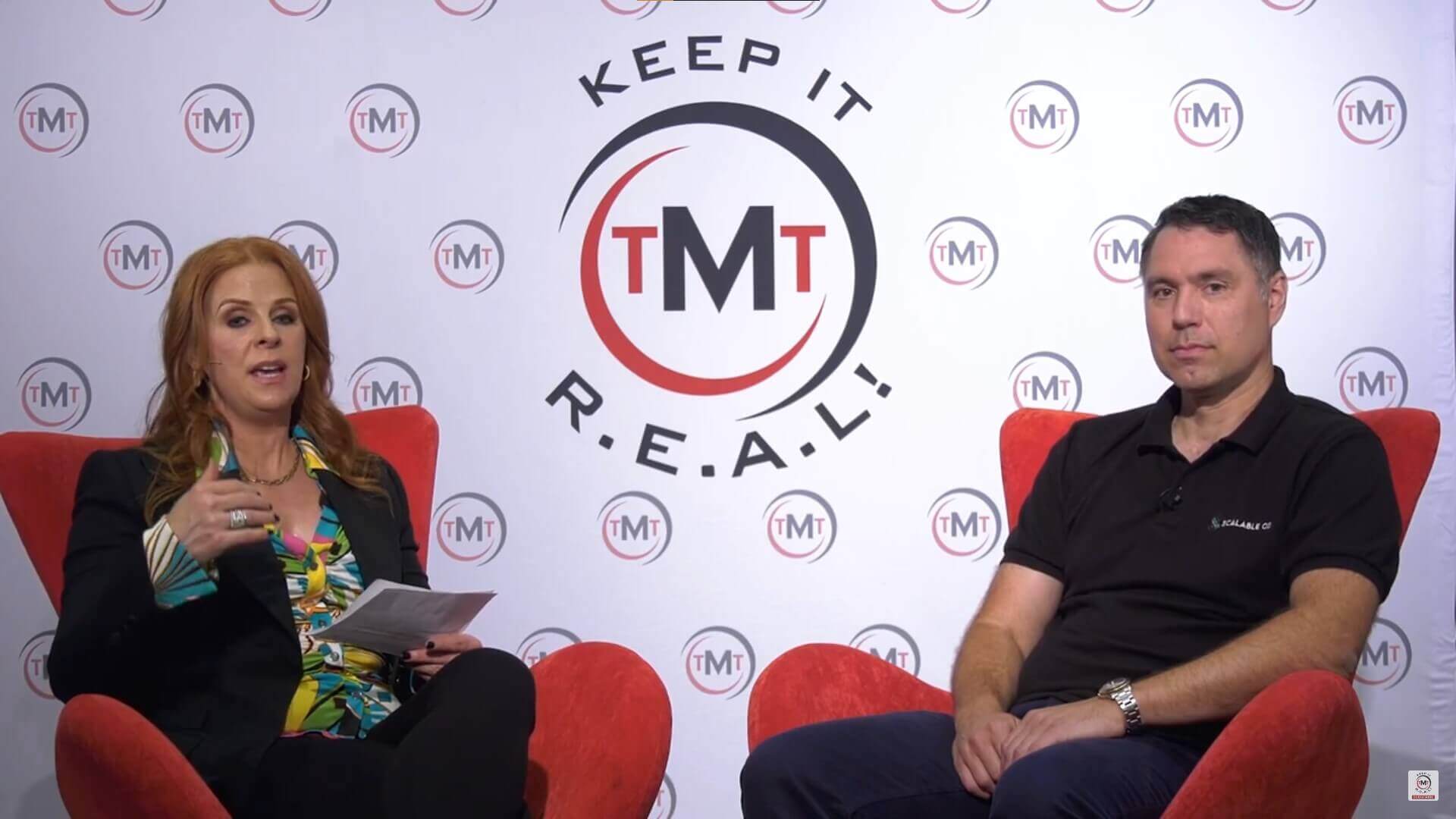 Robin Robins, left, interviewing Chris Van Vladricken in red chairs at TMT