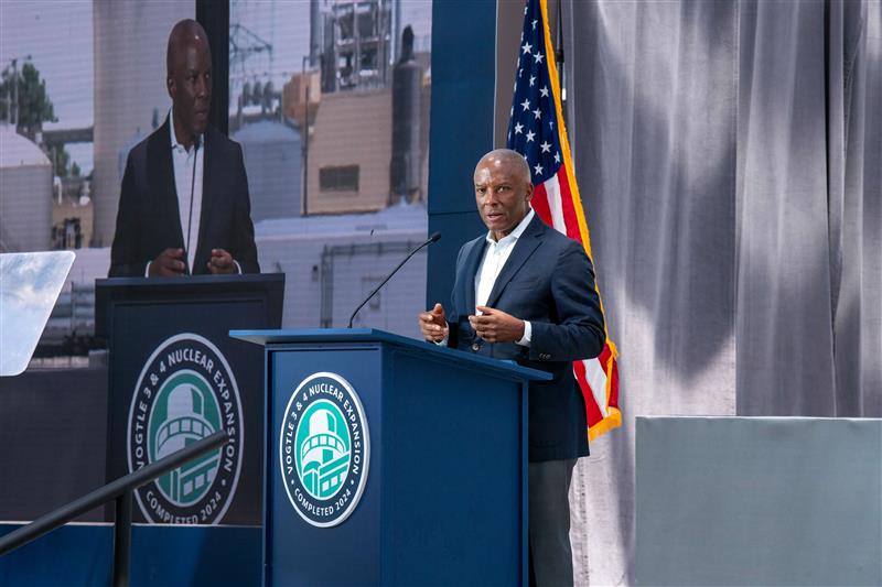 Chris Womack at the lectern during the celebration of Vogtle Unit 4 entering service