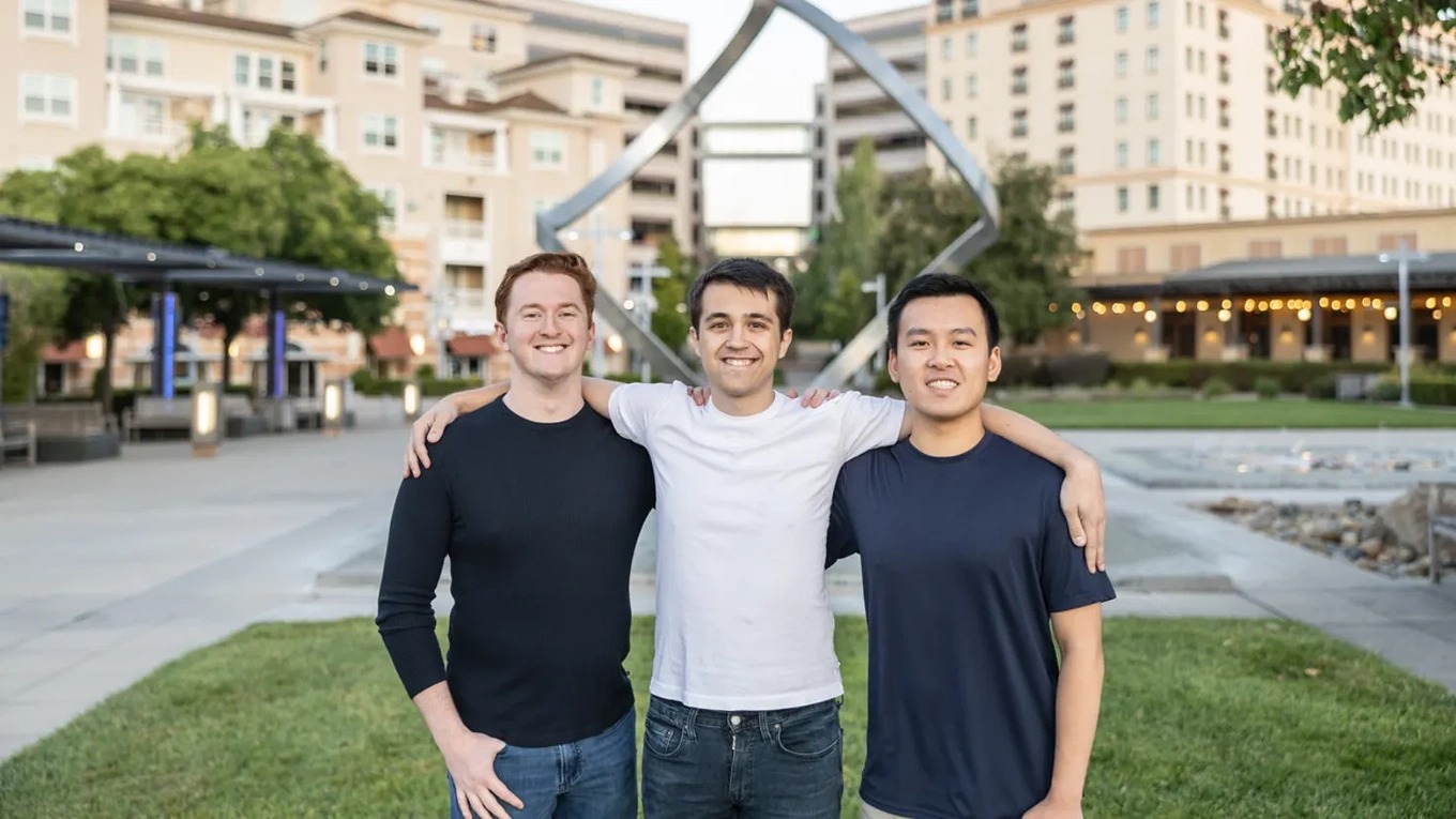 Etched co-founders Robert Wachen, Gavin Uberti, and Chris Zhu standing together outside