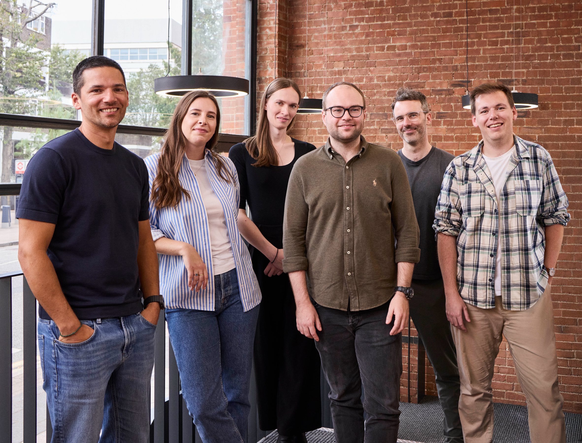 The six-person Clove team pictured in its office for the 2025 funding announcement
