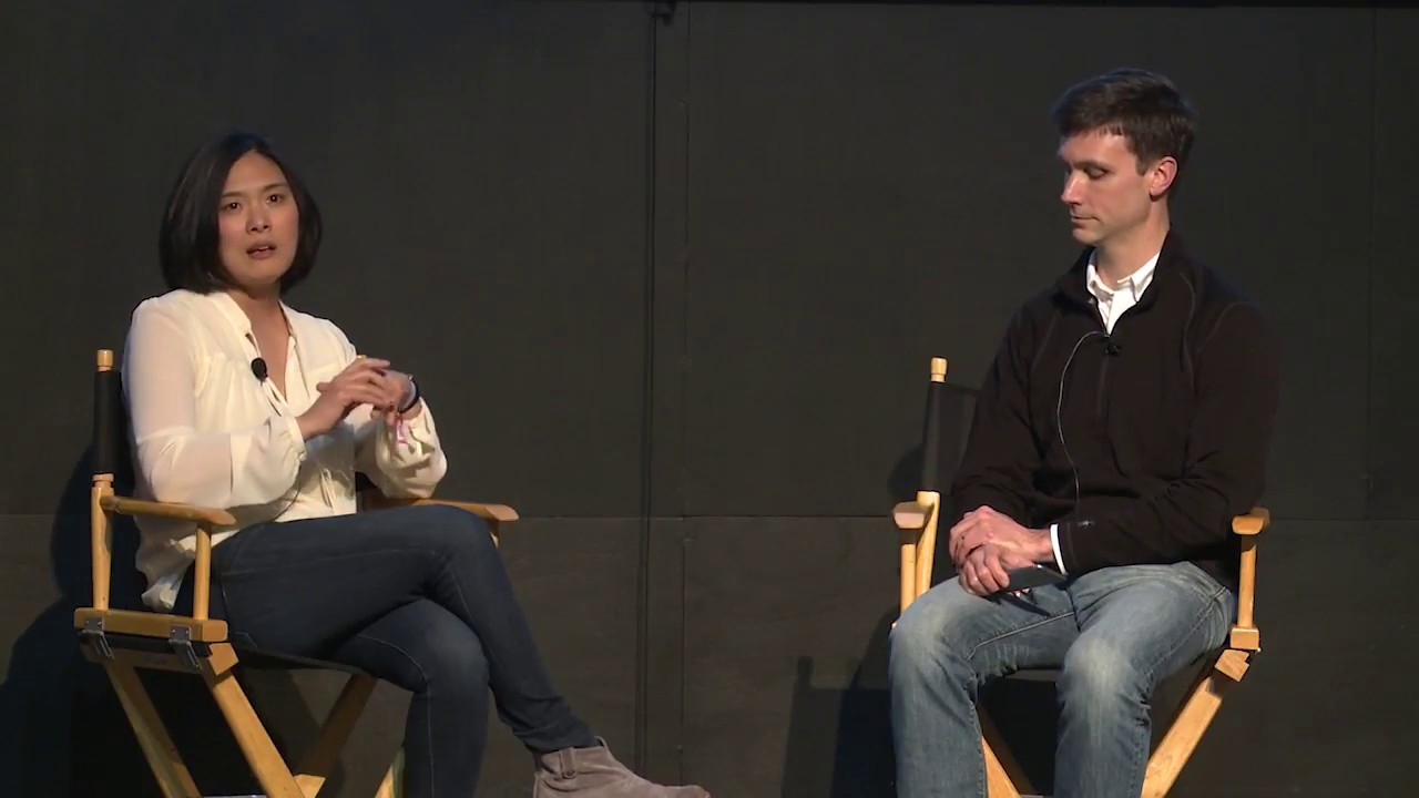 Christine Lemke, at left, speaking with another participant onstage at Startup Grind