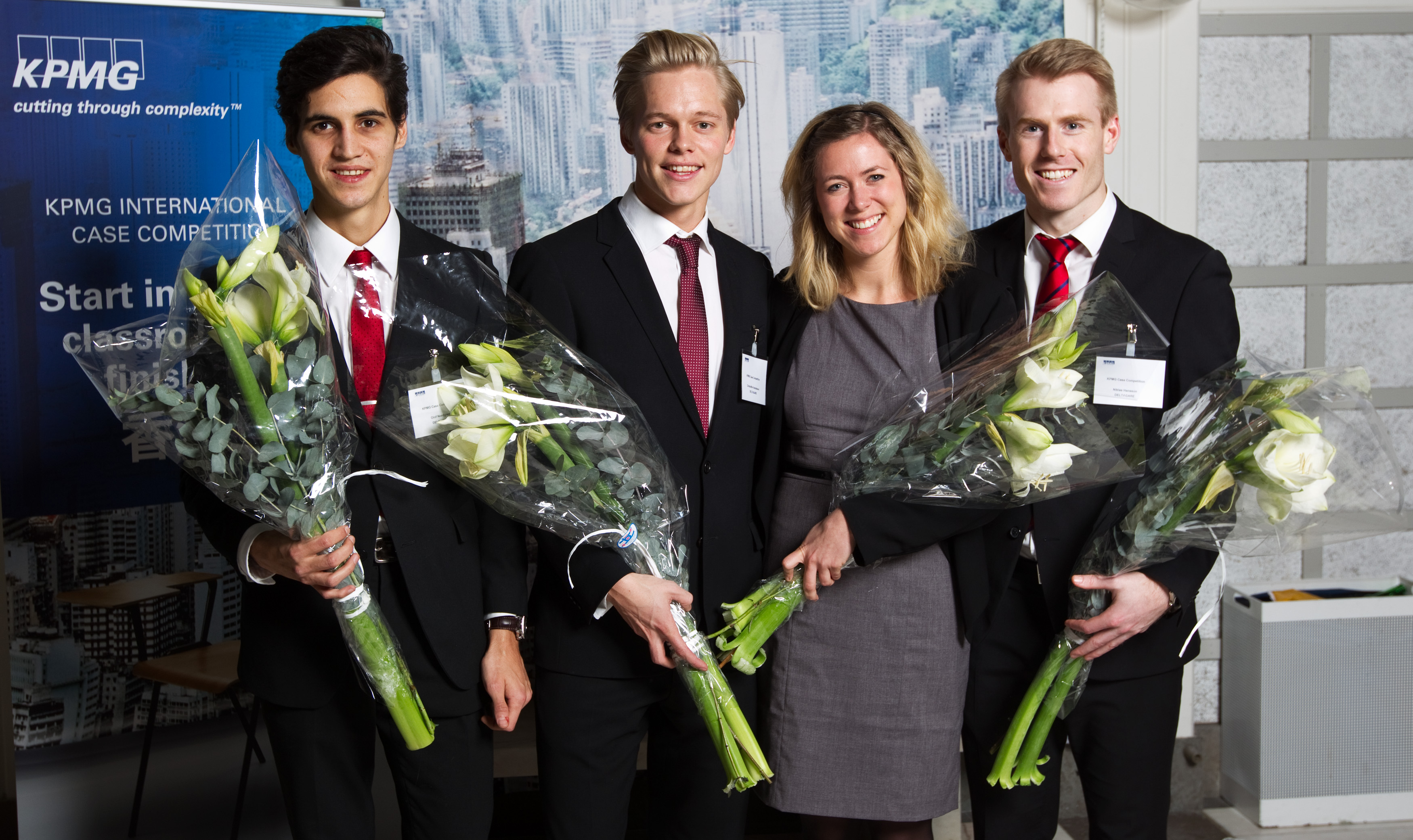 Christoffer Haraldsson and his Lund University teammates holding bouquets at the KPMG International Case Competition