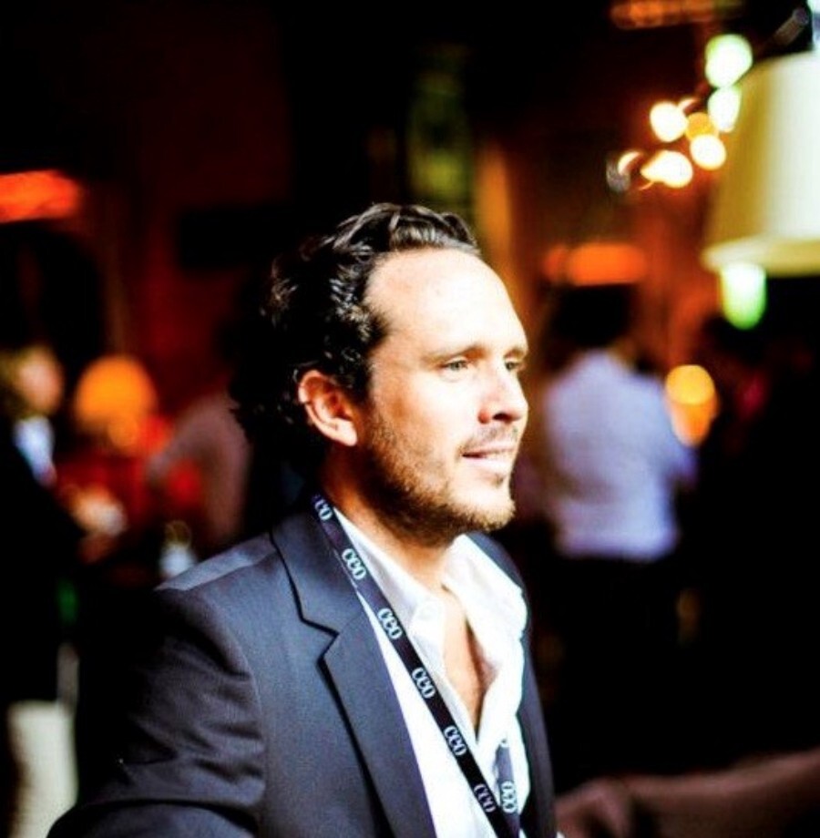 Christophe Garnier wearing a conference lanyard at an industry event
