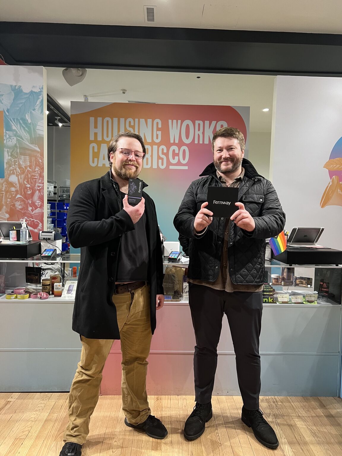 Kit Gallant and a colleague holding Fernway products at Housing Works Cannabis Co. in New York
