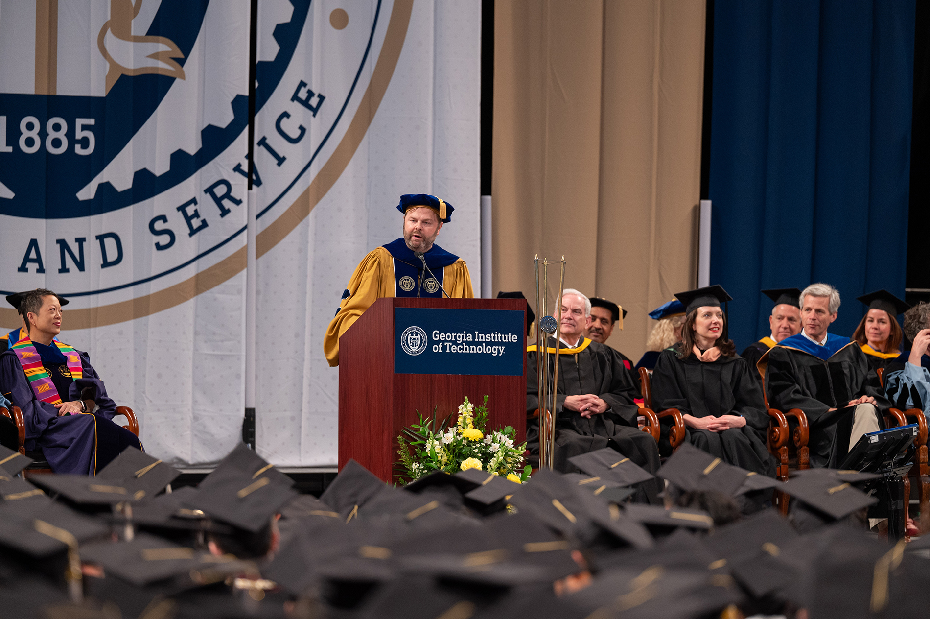 Christopher Klaus speaking from the lectern at Georgia Tech's May 2025 commencement