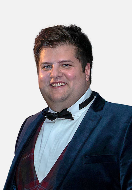 Christopher McGhee in formal dress at an early entrepreneurship event