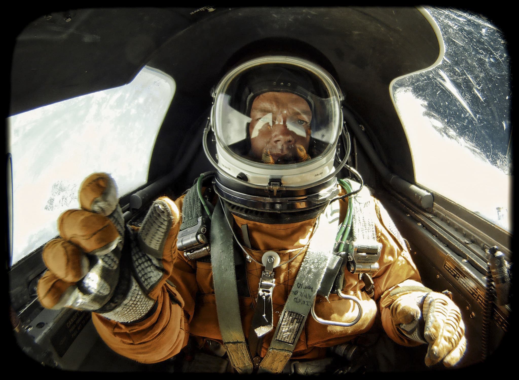 Christopher Michel wearing a pressure suit inside a U-2 cockpit