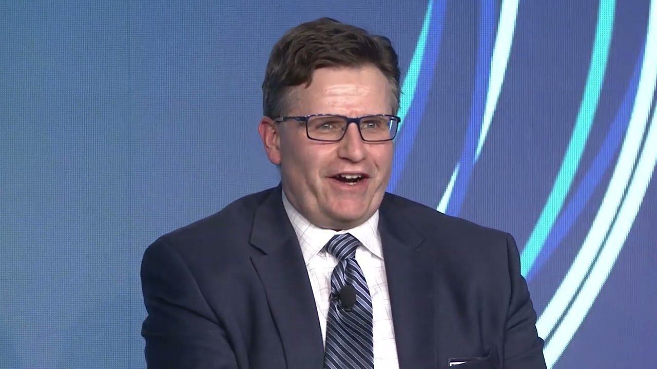 Christopher Murphy speaking during a 2022 manufacturing process-control panel