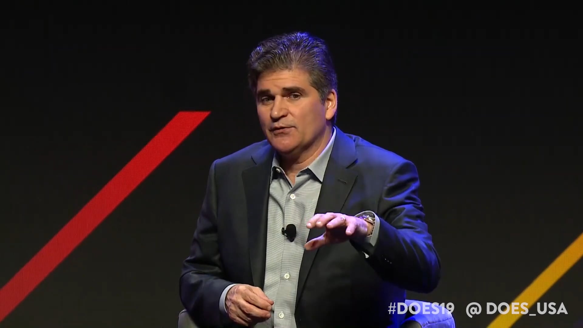 Christopher O'Malley speaking onstage at the 2019 DevOps Enterprise Summit