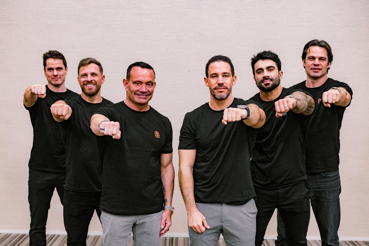 Chris Rondeau, third from left, with five Panobianco colleagues in matching black shirts.