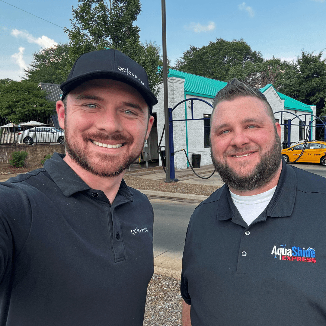 Chris Salerno, left, with an AquaShine colleague outside a car wash