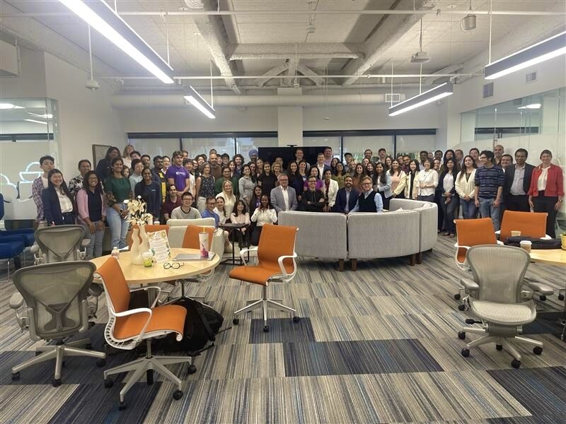 Divita and a large group of Teladoc colleagues gathered in an open office during the July 2024 West Coast visit