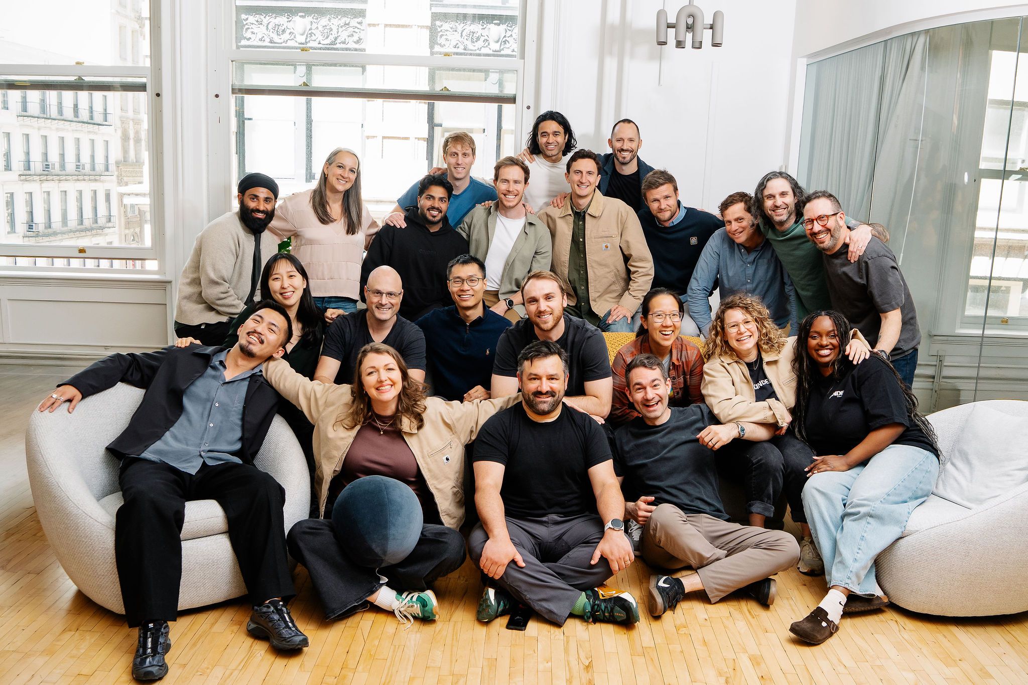 The Cinder team gathered for a group photograph in a bright office