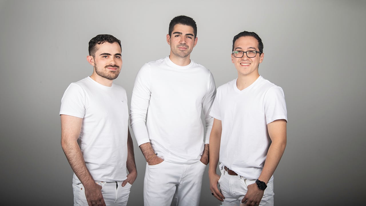 Cipriano Echavarria standing with Palomma co-founders Felipe Monsalve and Nicolas Gomez del Campo