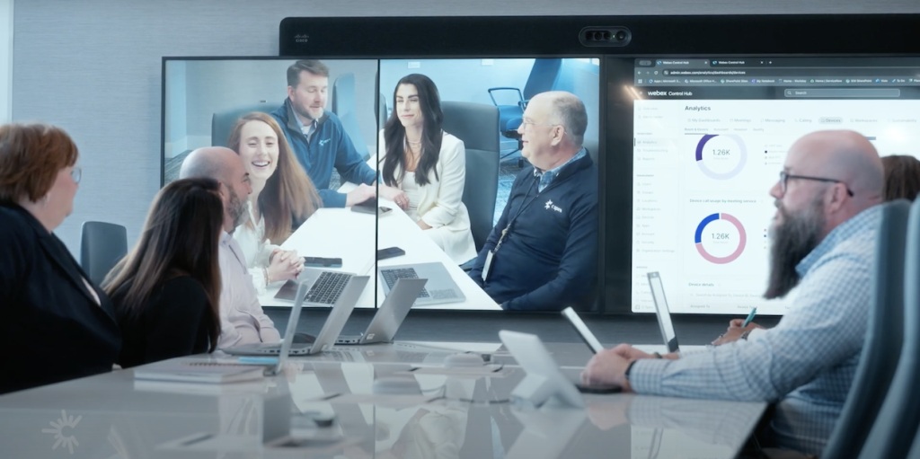 C Spire smart meeting room with collaboration equipment and a wall display