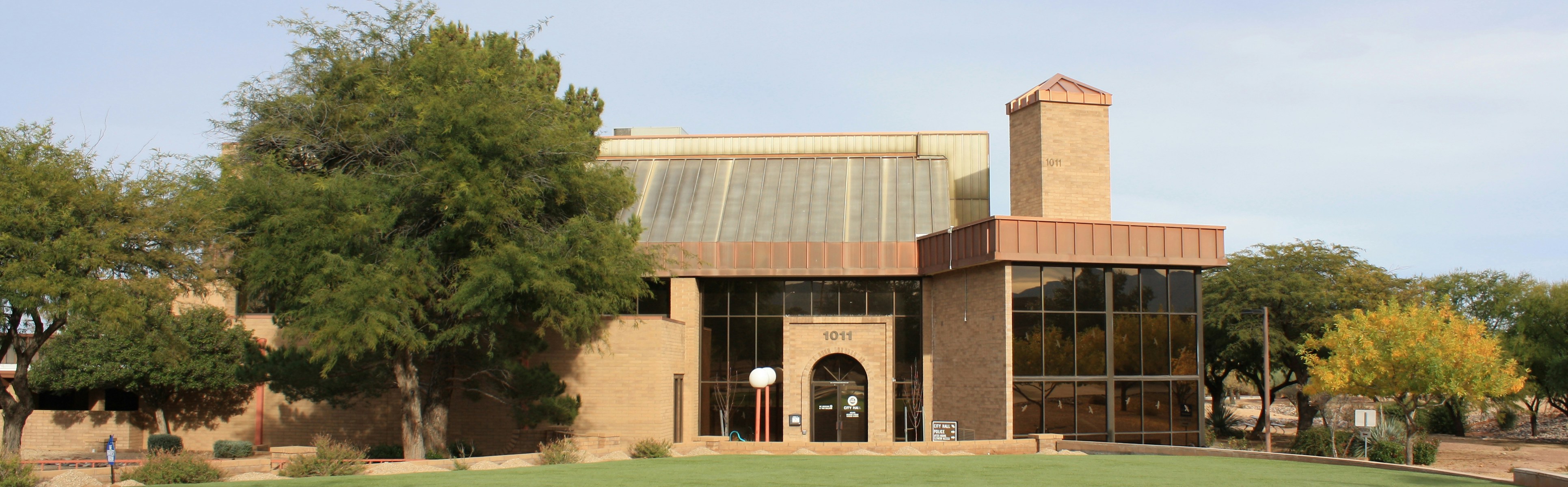 Sierra Vista City Hall, with its brick tower and trees shading the entrance