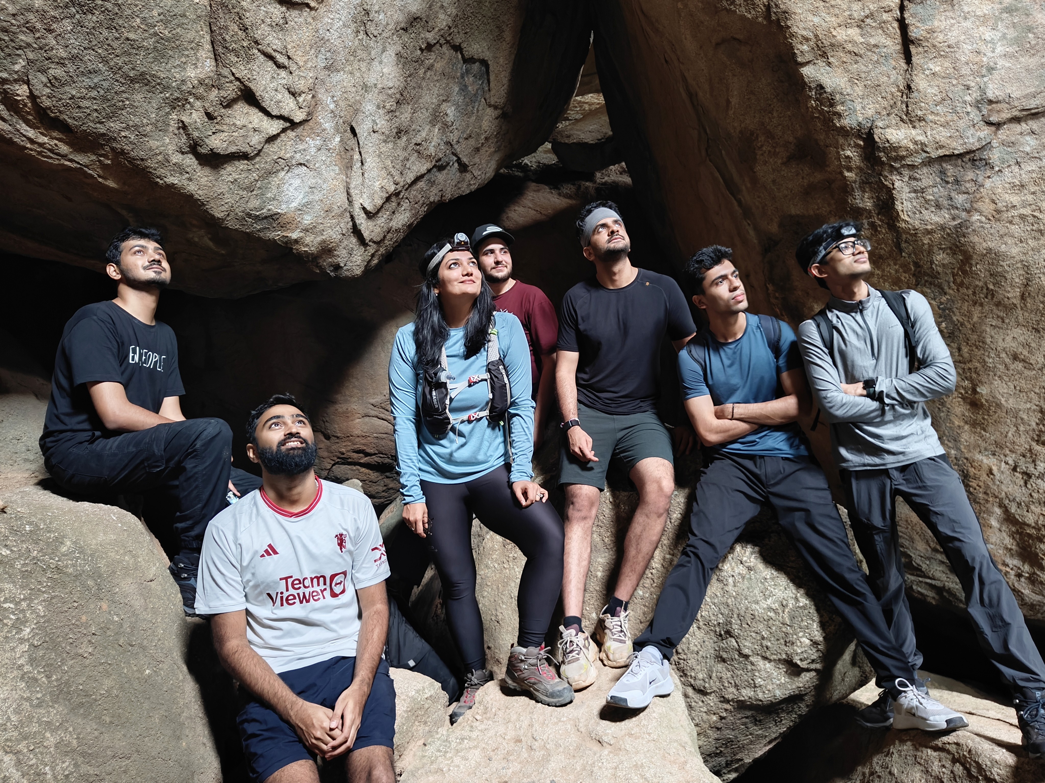 Clarisights team members wearing headlamps among large rock formations