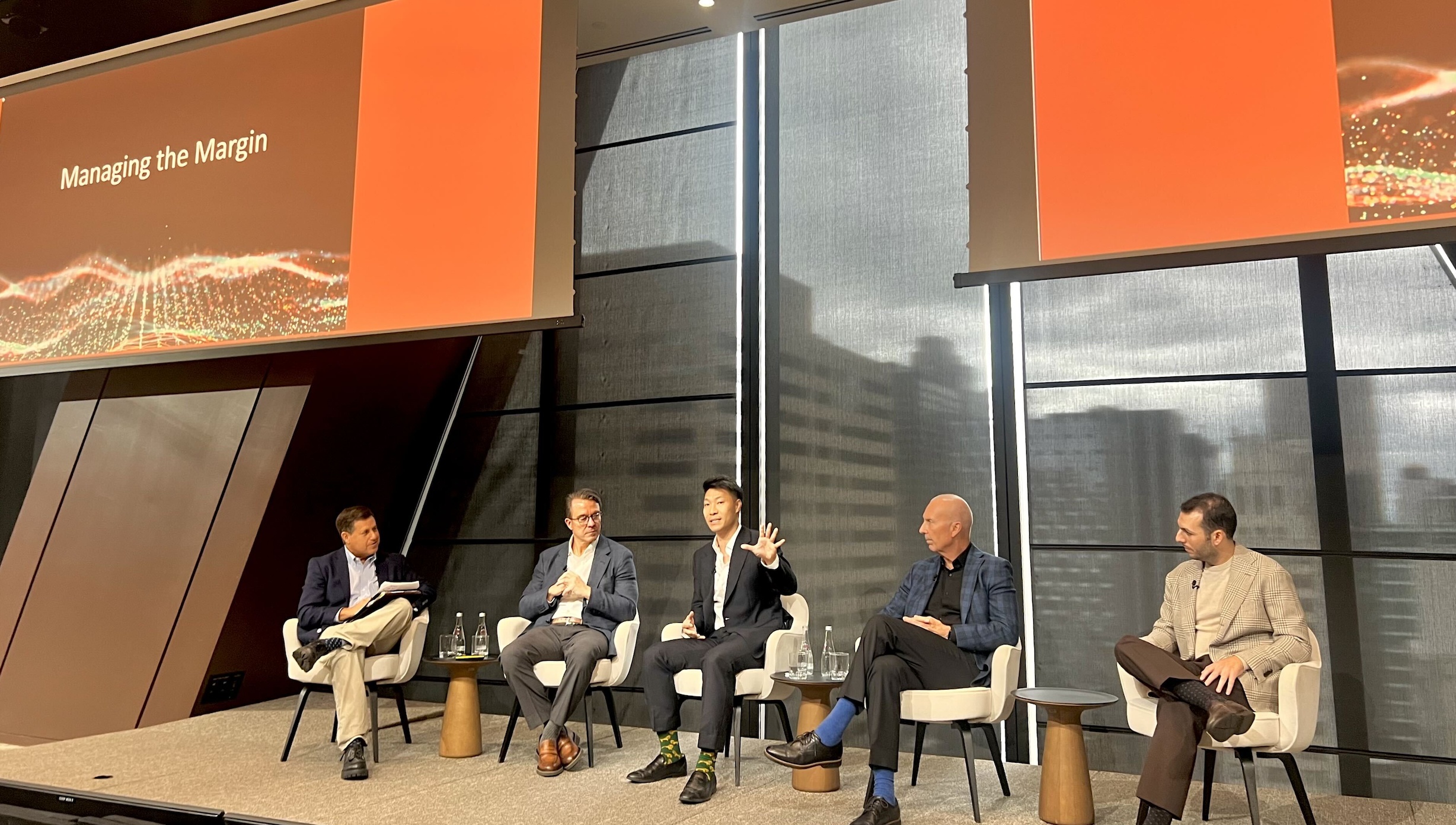 Steve Liou seated at the center of a five-person panel at J.P. Morgan’s health system summit