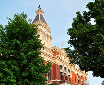 Historic Montgomery County Courthouse framed by trees in downtown Clarksville
