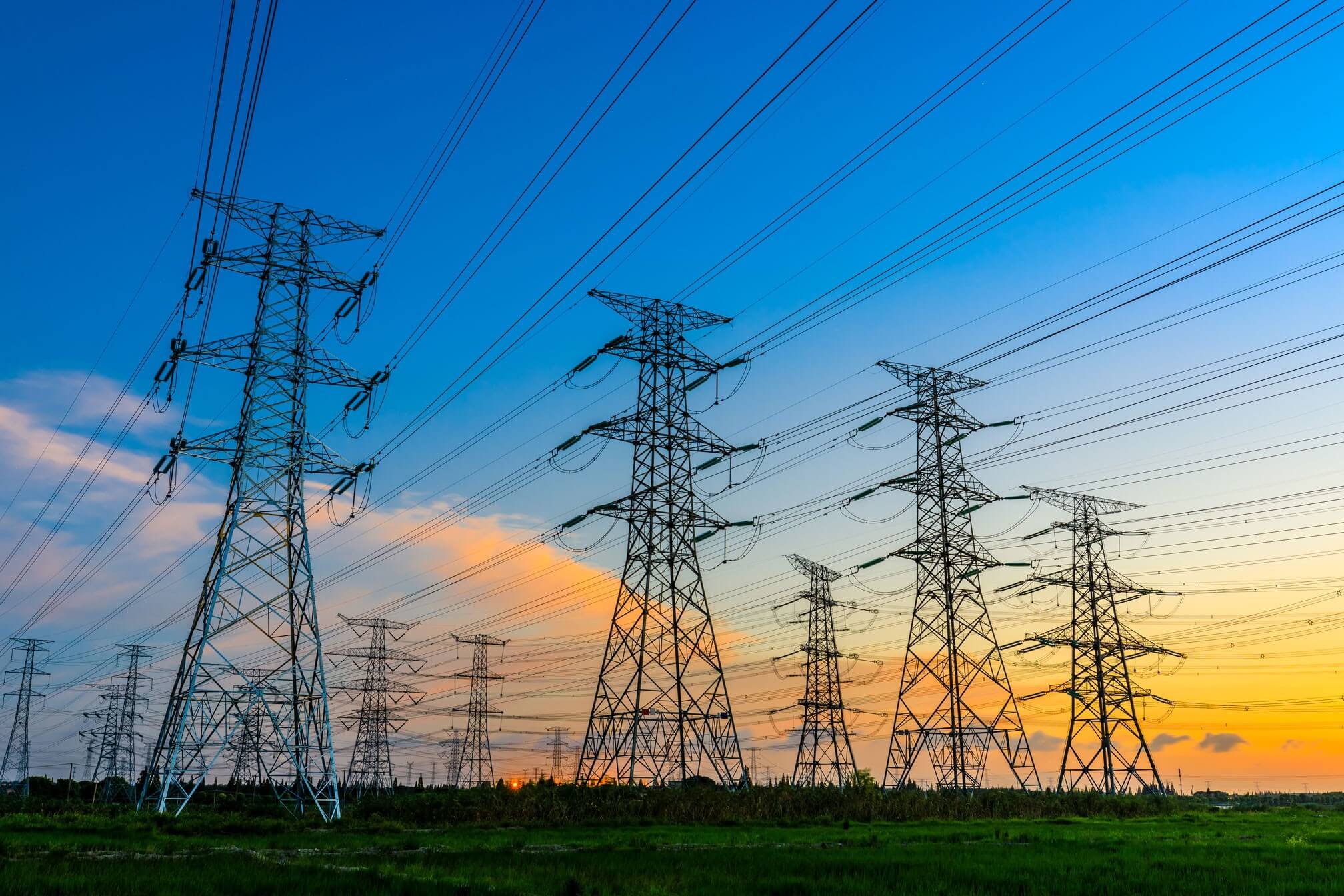 Electrical grid infrastructure at sunset