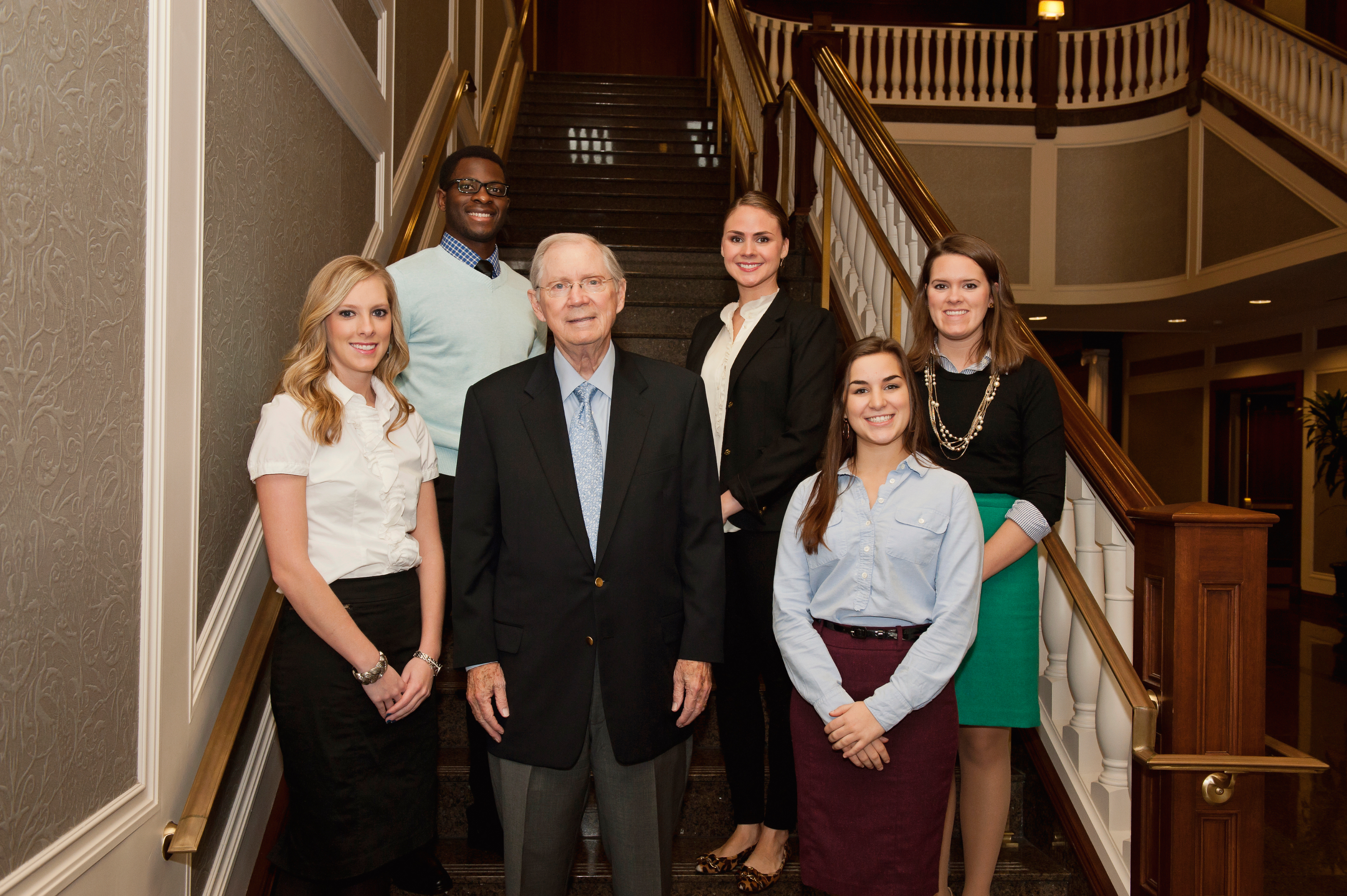 Clayton McWhorter standing with five McWhorter Scholars at Belmont University