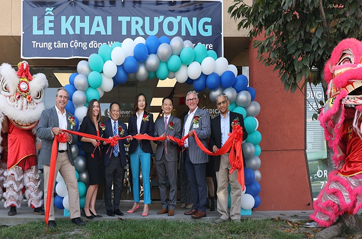 Ribbon-cutting at Clever Care’s Westminster community center, with balloons and lion dancers