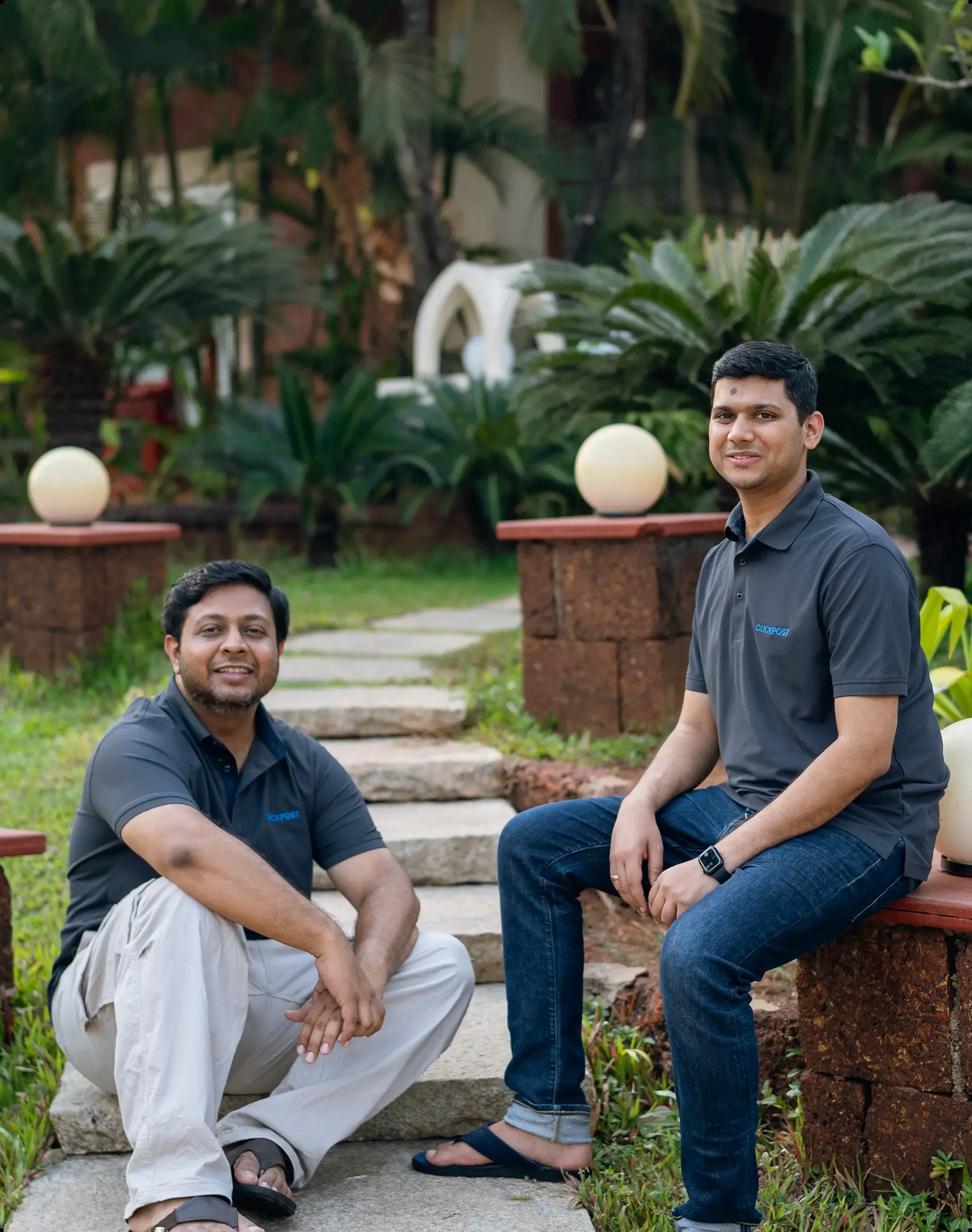 ClickPost co-founders pictured outdoors in company polo shirts