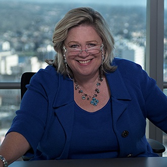 Bonnie Moss smiling in the firm’s official portrait