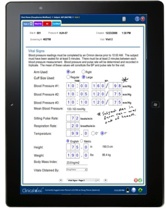 Archival SureSource tablet showing a vital-signs form and handwritten notes