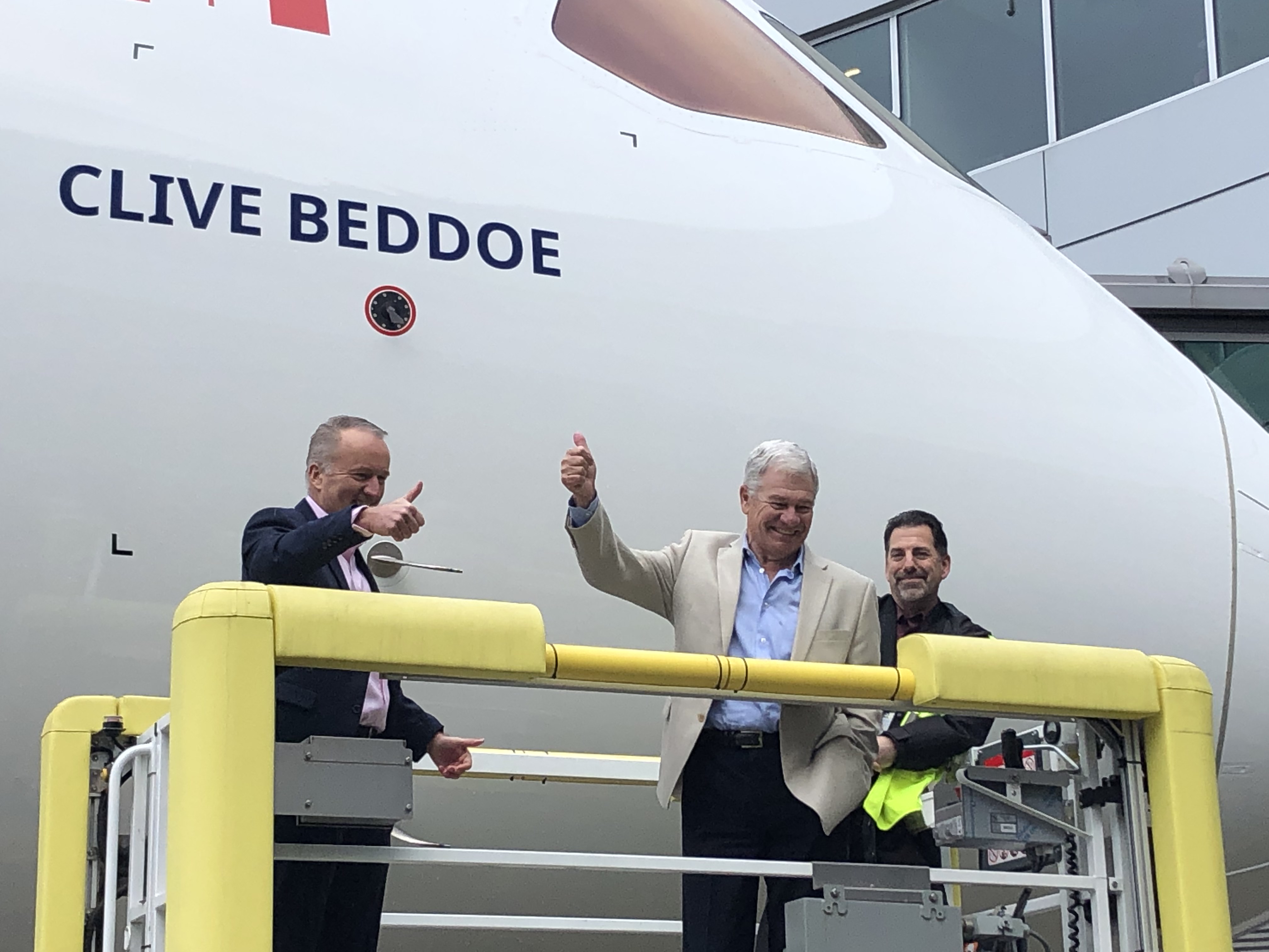 Clive Beddoe, centre, gives a thumbs-up beside his name on WestJet’s first Boeing 787 Dreamliner at its January 2019 delivery celebration.