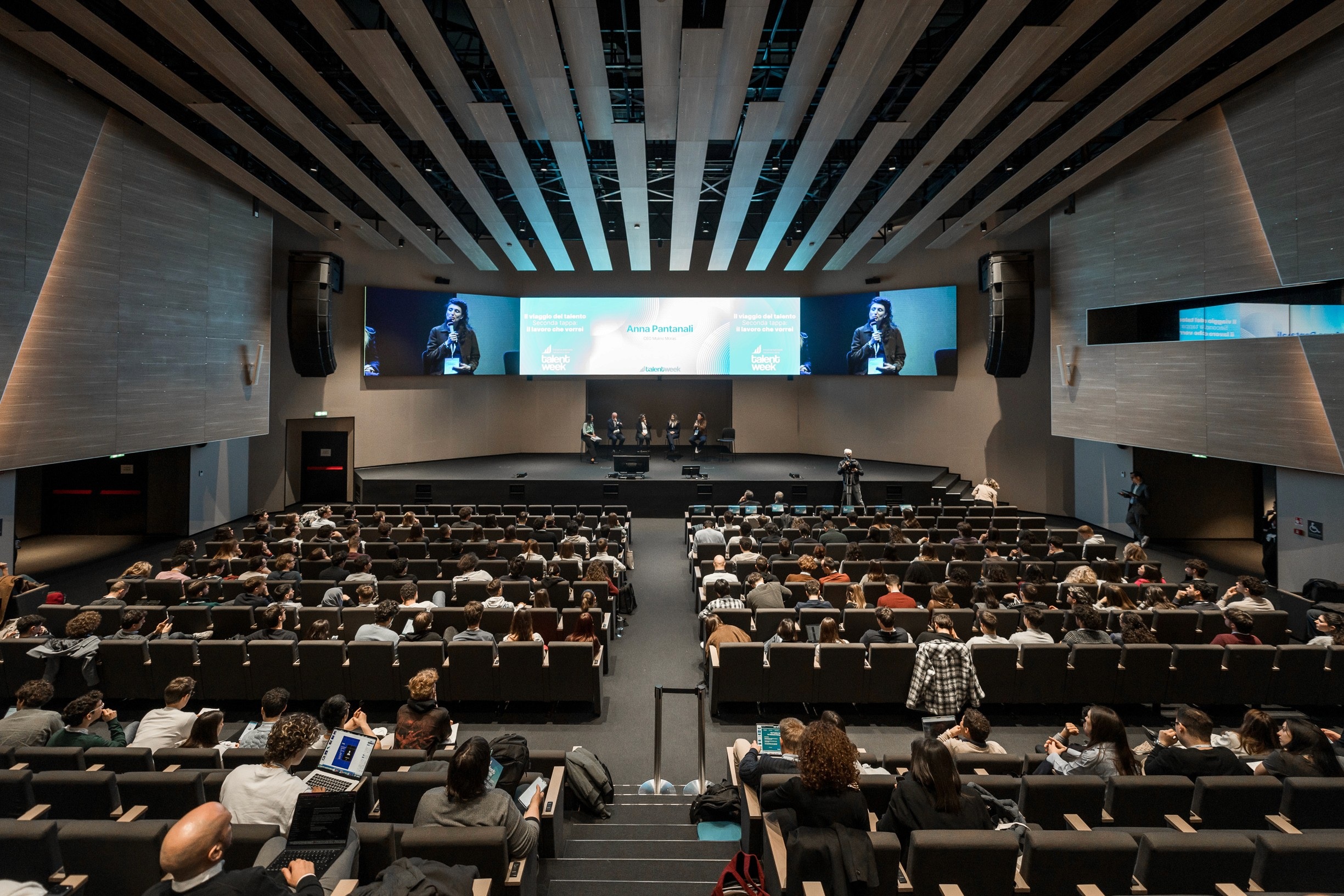Audience and speakers at Talent Week in a photograph published by Clover Venture