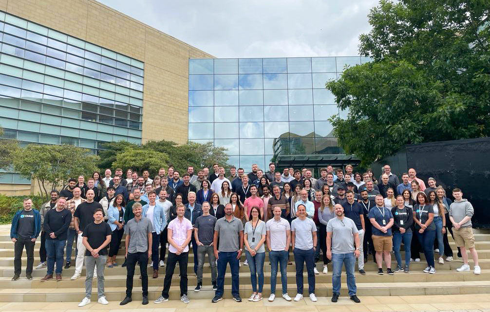 CMap team gathered on outdoor steps in a company photograph