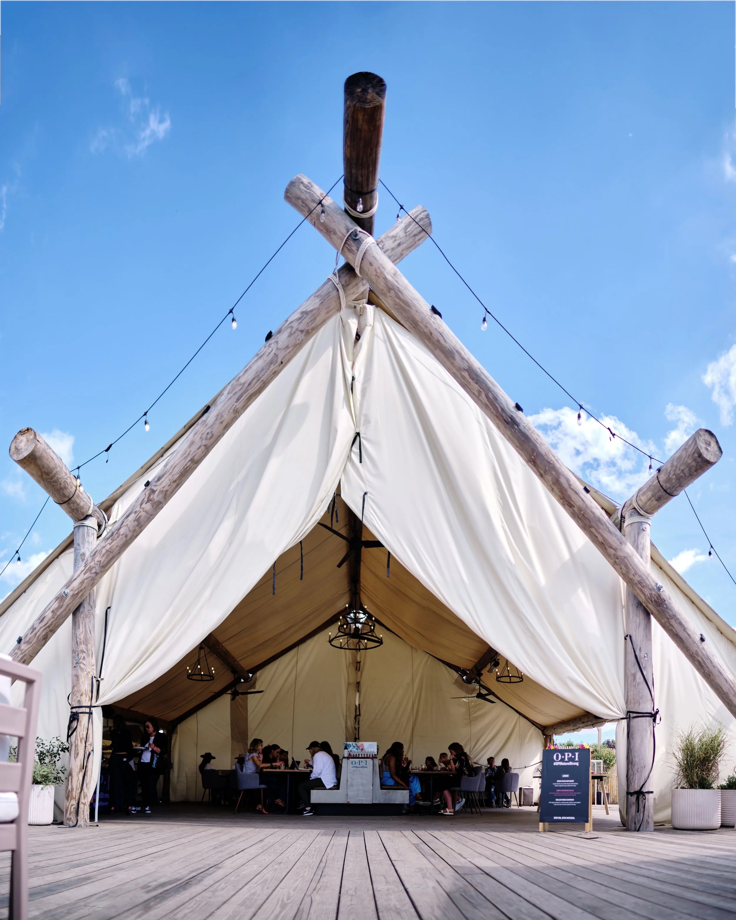The peaked canvas tent used for OPI Nature Strong's Governors Island launch experience