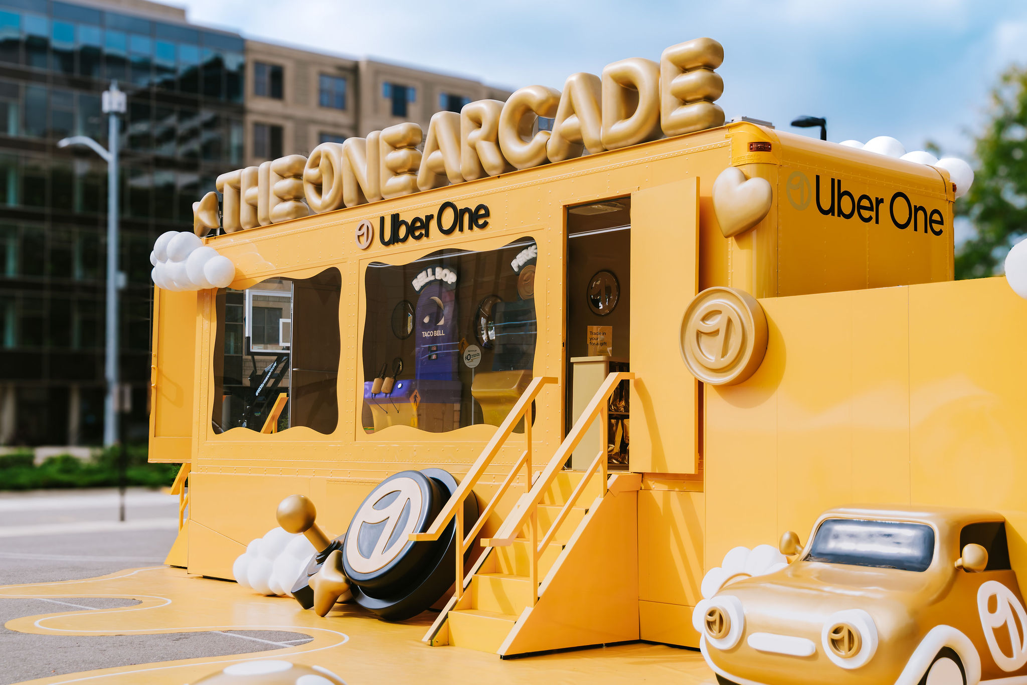 A bright yellow Uber One Arcade mobile activation produced by CNC Agency