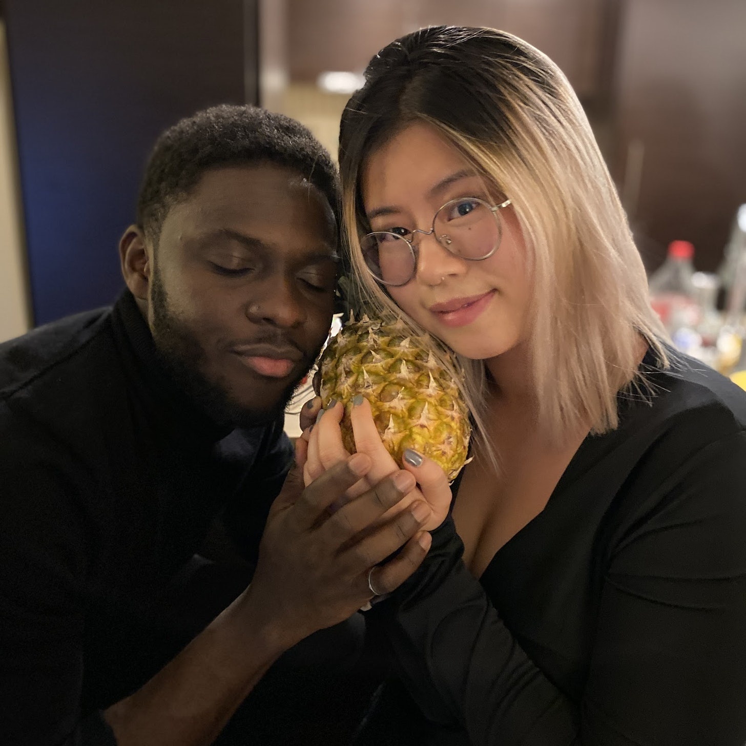 Co.Lab founders Sefunmi Osinaike and Helen Huang posing with a pineapple