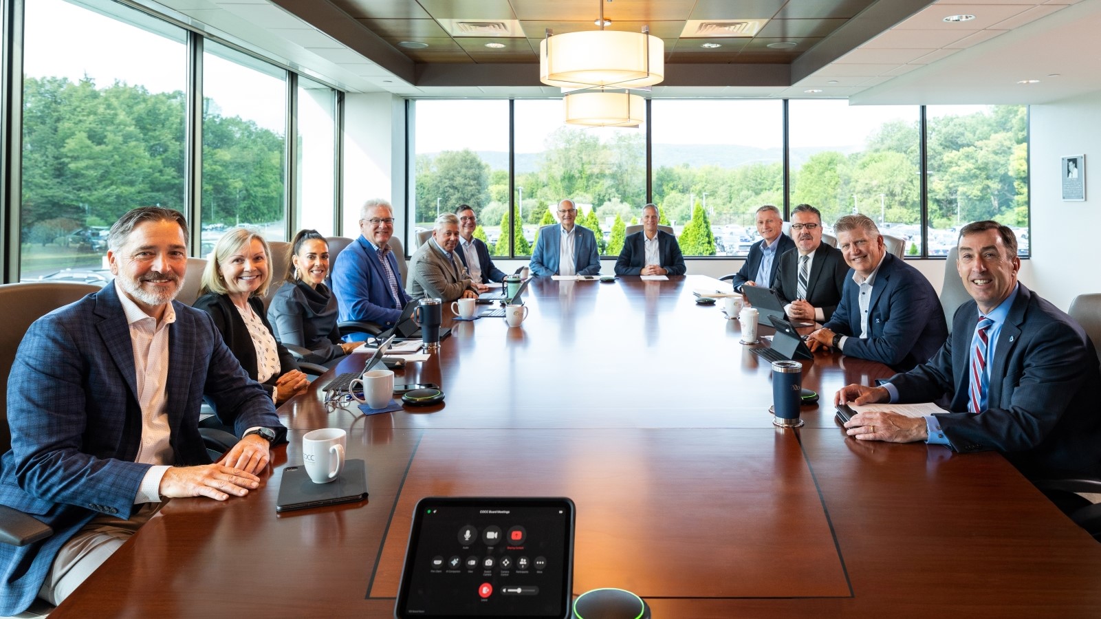 COCC board members seated around a long conference table