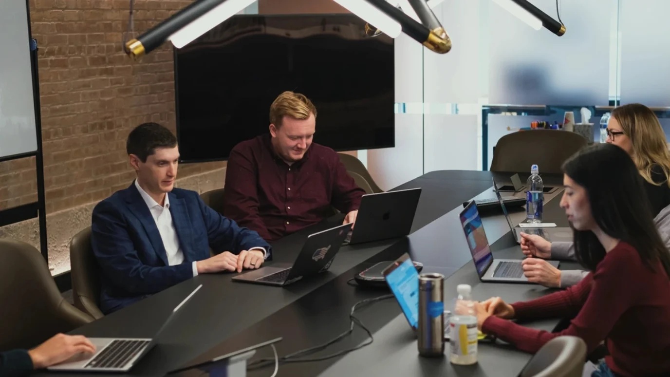 Codal colleagues working together around a conference table