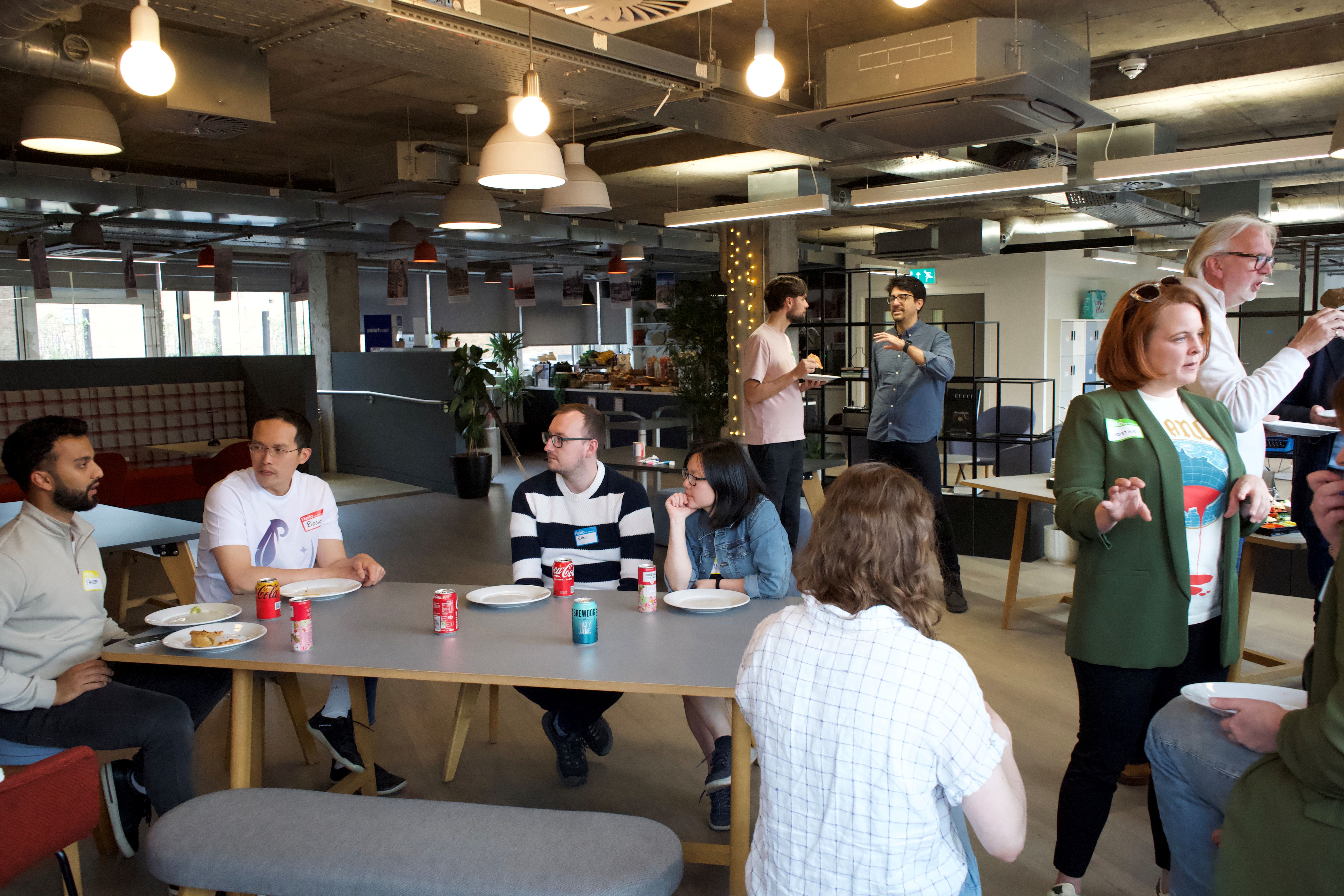 People talking around tables at a Catalyst gathering in Glasgow’s Clockwise coworking space