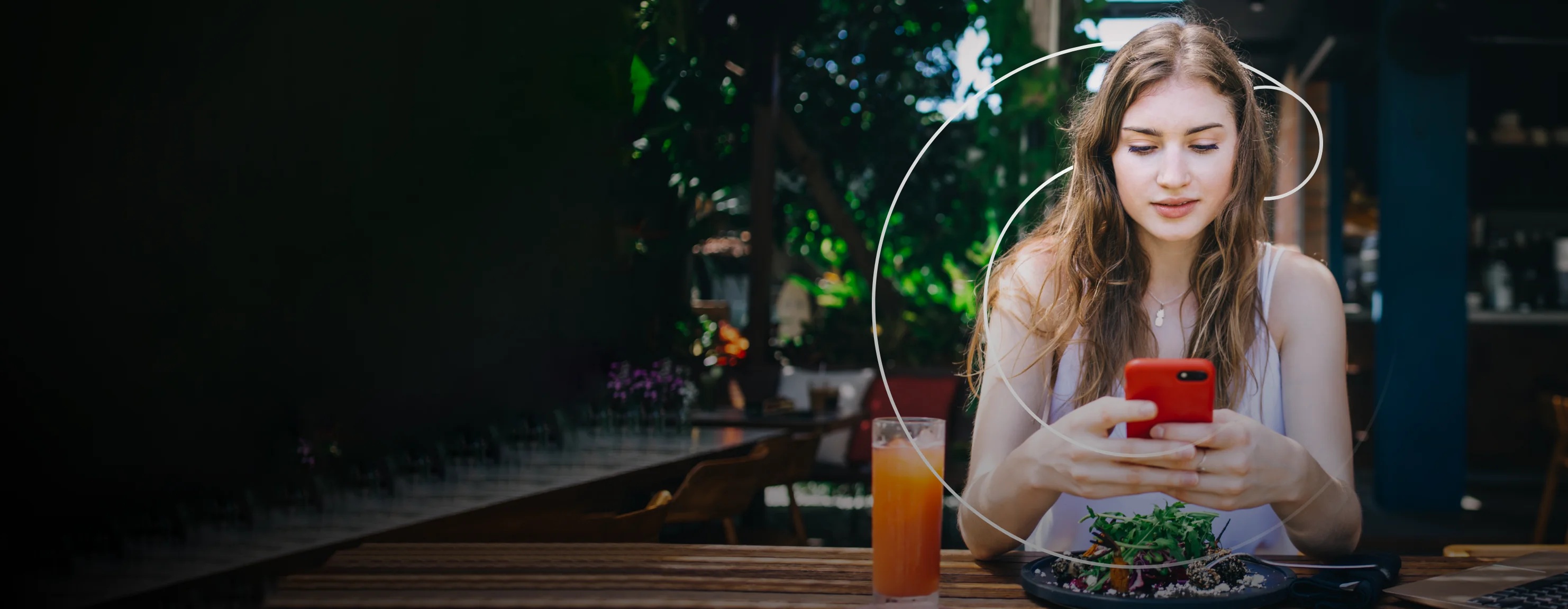 CalCounts promotional photograph of a woman using a phone beside a meal