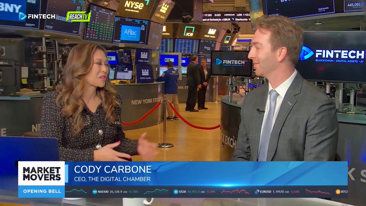 Cody Carbone speaking with a Fintech.TV interviewer on the New York Stock Exchange floor