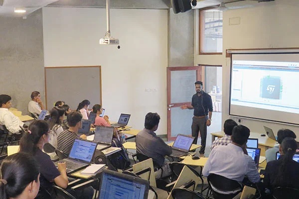 Participants with laptops attending a technical workshop at Bhau Institute